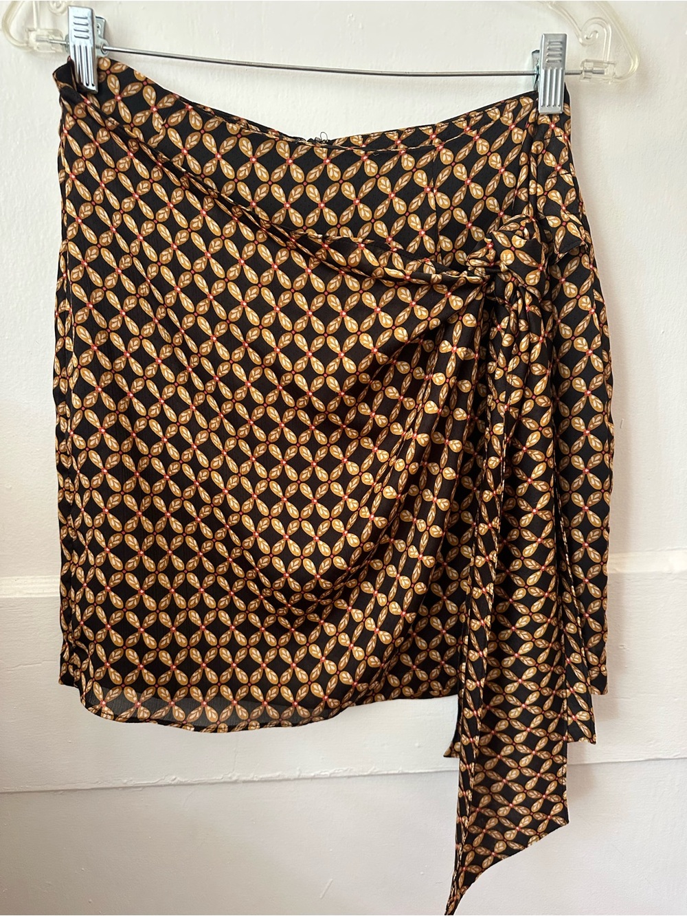 MINKPINK Black Wrap Skirt with Gold Medallion and Red Dot Accents